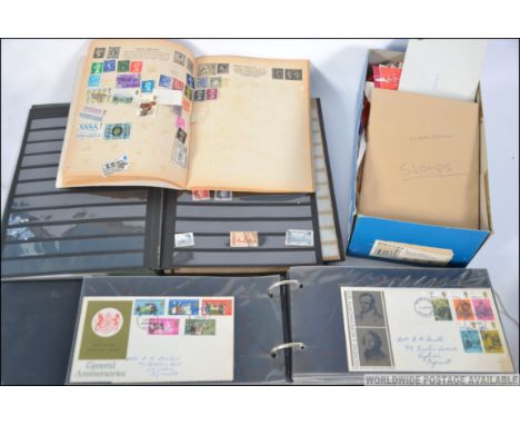 A collection  of First Day Covers dating from the 1970's along with  Gay Venture stamp album along with another and a shoe bo