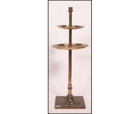 A beautiful large brass freestanding candlestick stand with twin brass circular tiers under single scone holder. All over sol