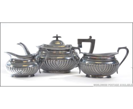 An early 20th century silver plated tea service comprising teapot, sugar bowl and creamer being marked EPBM. Measures: 15cms 