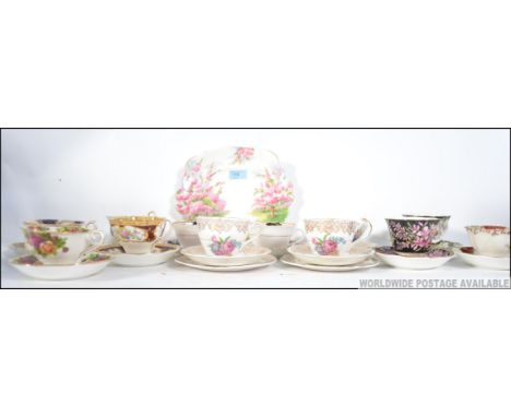 A harlequin set of a dozen mixed cups to include Royal Albert and others with matching saucers , a Royal Albert ' Blossom Tim