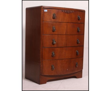 A 1930's bow front chest of drawers having inset plinth base with drop handles to the drawers. Measures(cm) Height 102 x Widt