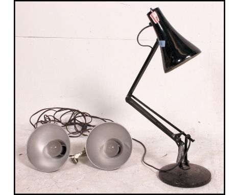A retro 20th century Herbert Terry Anglepoise lamp along with a pair of vintage pendant industrial light shades