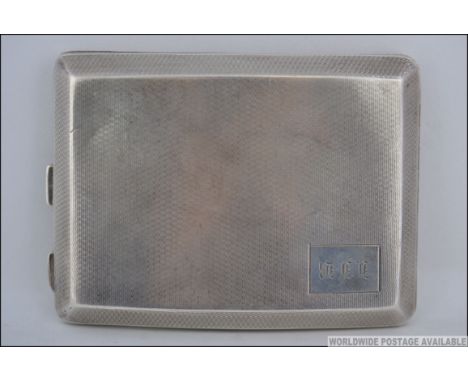 A good engine turned silver hallmarked cigarette case, by William Neale & Sons Ltd bearing Birmingham hallmarks for 1928 Tota