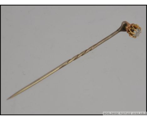 A Victorian 9ct gold and diamond stick pin / hat pin, the diamond approx 20pnts. Total weight 1.7g
