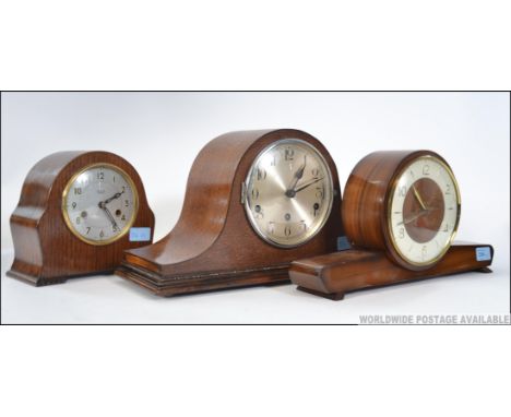 A group of  3 mantle clocks . 1 Westminster and whittington chime clock movement marked ' Haller ' , 2 Smiths clocks one of g