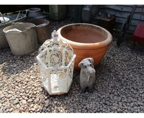 Stone dog figure, painted metal bird cage and large terracotta planter