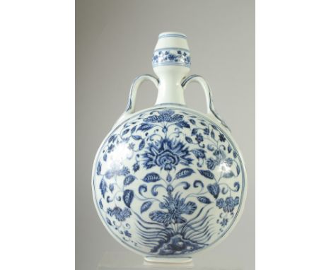 A CHINESE BLUE AND WHITE PORCELAIN TWIN HANDLE MOON FLASK, painted with central floral spray.