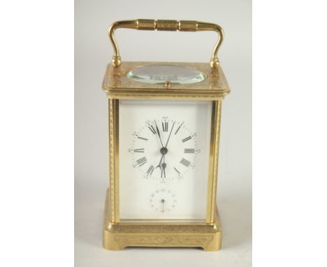 A GOOD 19TH CENTURY FRENCH ENGRAVED BRASS CARRIAGE CLOCK, repeater with alarm, in a leather carrying case. 5.25ins high.