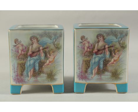 A PAIR OF BLUE SEVRES DESIGN SQUARE CACHES POTS with classical design panel. 7ins high.