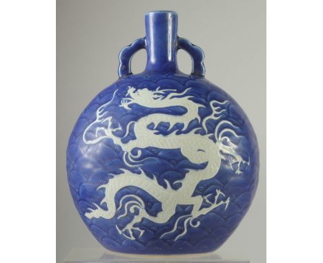 A CHINESE SACRIFICIAL BLUE AND WHITE PORCELAIN DRAGON MOON FLASK. 28ins high.