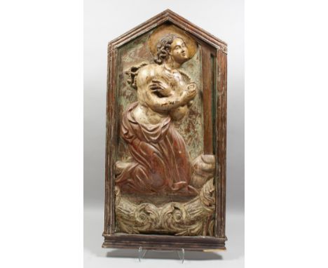 A LATE 17TH CENTURY CARVED WOOD AND POLYCHROME PANEL OF A SAINT WITH ARMS CROSSED. 46ins high, 22ins wide.