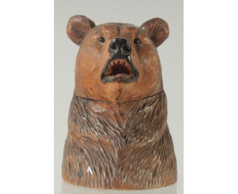 A GOOD BLACK FOREST BEAR INKWELL with hinged head. 4.5ins high.