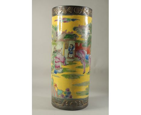 A CHINESE PORCELAIN YELLOW GROUND STICK STAND. 23ins high.