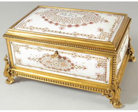 A SUPERB EMERALD AND GILT METAL FITTED JEWELLRY BOX with white enamel panels and inner fittings 9ins long.