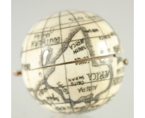 A CARVED BONE BALL COMPASS.  1.5ins diameter.