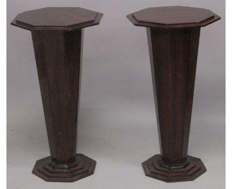 A PAIR OF ART DECO STYLE ROSEWOOD OCTANGONAL PEDESTAL STANDS. 2ft 6ins high x 1ft 4ins wide.