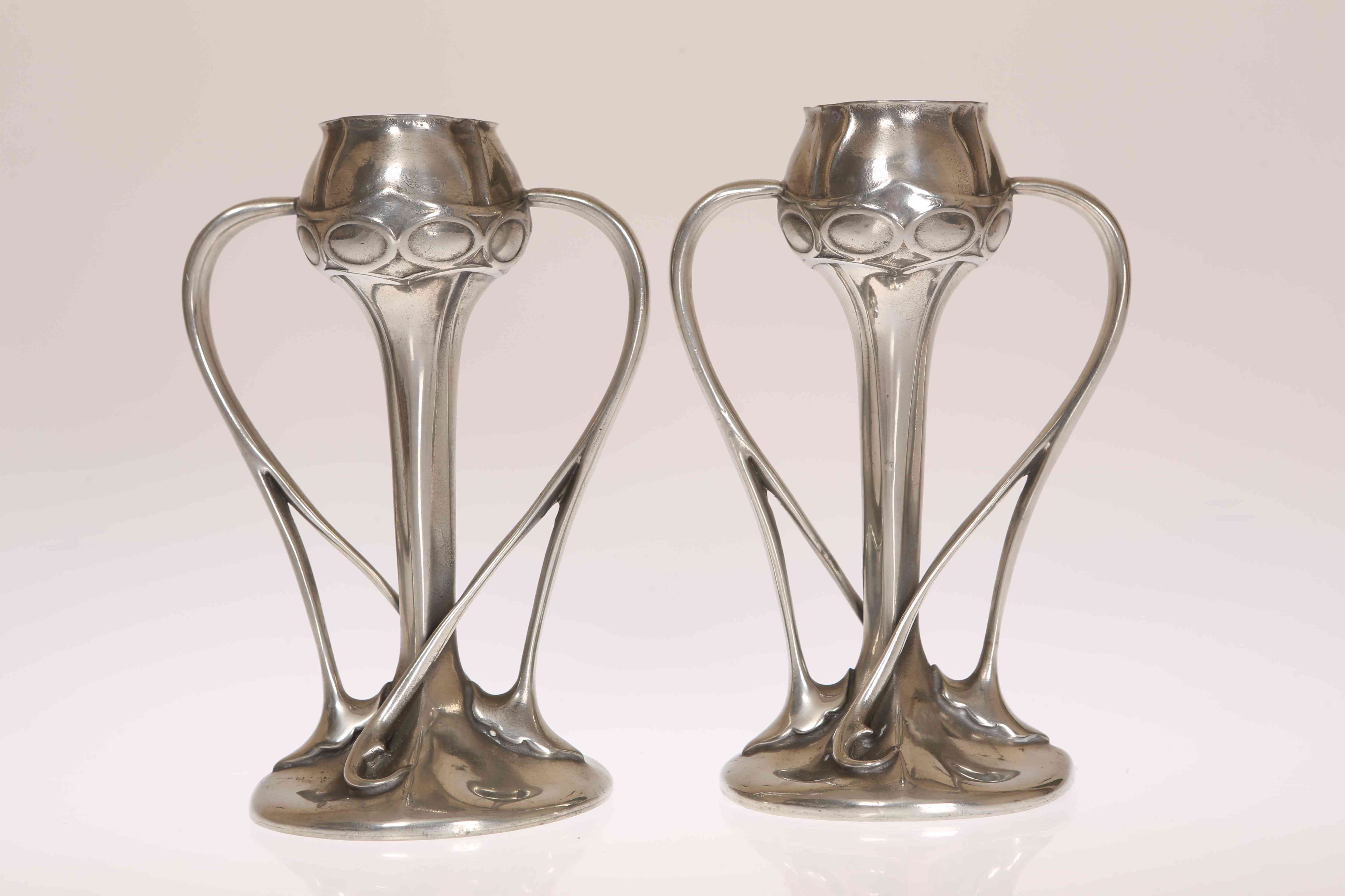 A PAIR OF LIBERTY & CO TUDRIC PEWTER TULIP VASES, DESIGNED BY ARCHIBALD