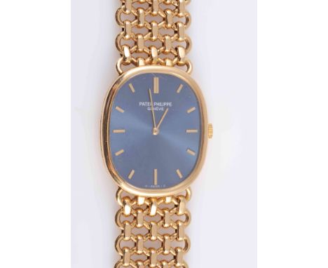 A PATEK PHILIPPE 18 CARAT GOLD ELLIPSE WRISTWATCH, the rounded rectangular case with blue sunburst dial and baton markers, si