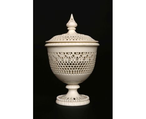 A ROYAL WORCESTER RETICULATED VASE AND COVER BY GEORGE OWEN, CIRCA 1929, shape no. G832, incised signature and gilt factory m