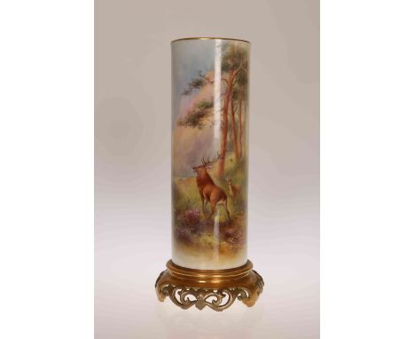 A ROYAL WORCESTER CYLINDRICAL VASE, CIRCA 1932, painted with deer in a wooded landscape by Harry Stinton, with pierced and gi