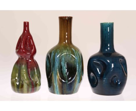 LINTHORPE POTTERY, NOS. 24 AND 326THREE DIMPLED VASES, the first of double gourd form with red and green glaze, the second wi