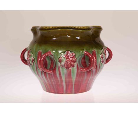 LINTHORPE POTTERY, NO. 535A JARDINIERE, moulded with flowerheads interspersed by double ring handles, glazed in green and red