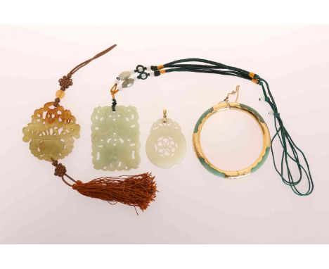 A SMALL COLLECTION OF CHINESE JEWELLERY, comprising a bangle and three pendants. (4)