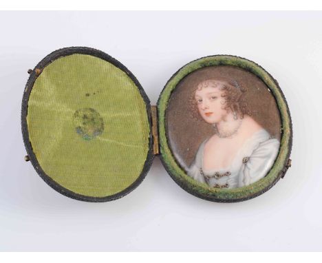 A PORTRAIT MINIATURE OF A LADY IN LATE 17TH CENTURY DRESS, painted enamel, oval in fitted shagreen case, 5cm 