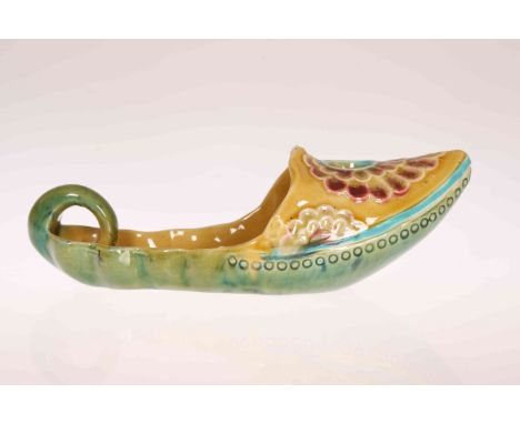 LINTHORPE POTTERY, NO. 2109A CANDLE HOLDER, in the form of an Eastern slipper, moulded with flowerheads, impressed marks. 19.