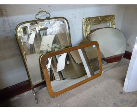 A brass mirrored firescreen and three mirrors 