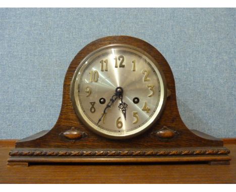 An oak mantle clock 