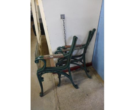 Two pairs of cast iron bench ends 