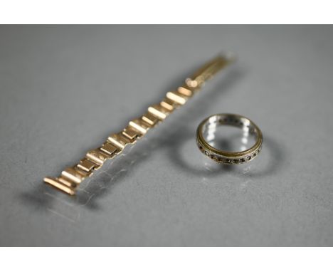 A fragment of 9ct gold watch-strap, 3.4g, to/w a 9ct yellow and white gold eternity ring set with gemstones, 2.8g gross 