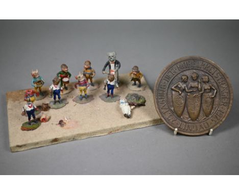 A novelty eleven-piece band of anthropomorphic animals, in cold-painted metal with wobbling heads, 5 cm high to/w a bronze me