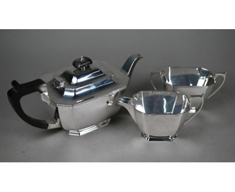 A heavy quality silver three-piece tea service of elongated octagonal form, with composite handle and finial, on moulded foot