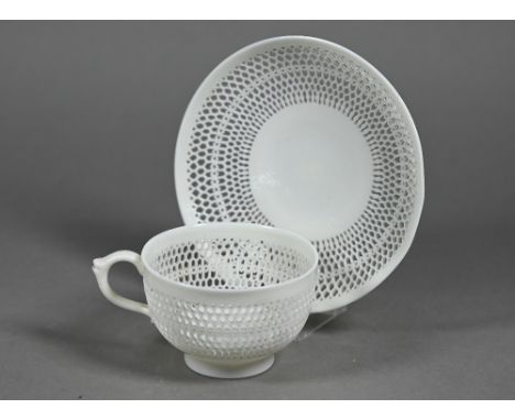 A Victorian Royal Worcester cabinet cup and saucer with delicate reticulated body, saucer 11 cm diam (no losses or damage) 