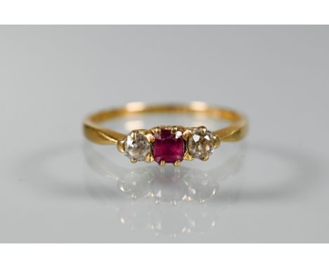 An 18ct yellow gold ring set ruby and two diamonds, size N 