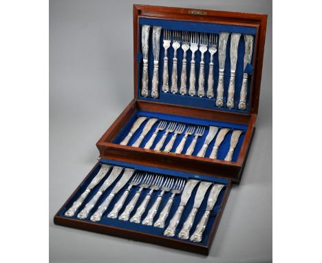 A Victorian mahogany canteen fitted with a set of sixteen each silver knives and forks with loaded handles, the blades engrav
