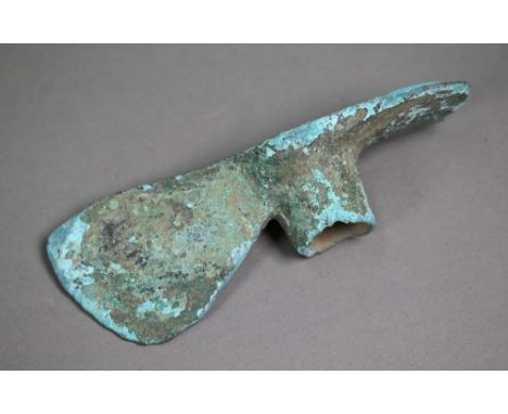 A Bronze Age (probably Luristan) axe-head of mattock form, 16 cm long 