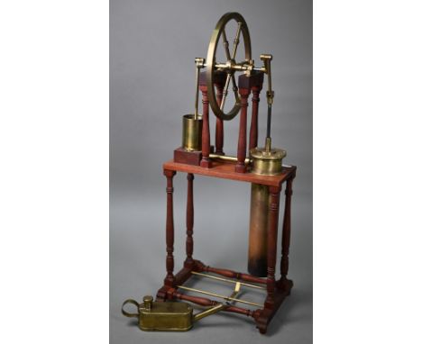 A brass and steel model of an 1816 Stirling engine, 57 cm high, to/w oil-can (2) 