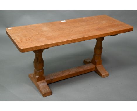 Robert 'Mouseman' Thompson, Kilburn, an oak coffee table, the rectangular adzed top raised on two octagonal supports united b