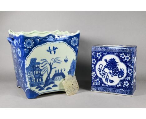 A 20th century Chinese blue and white flower brick printed with Buddhistic guardian lions on prunus and cracked ice ground, 1