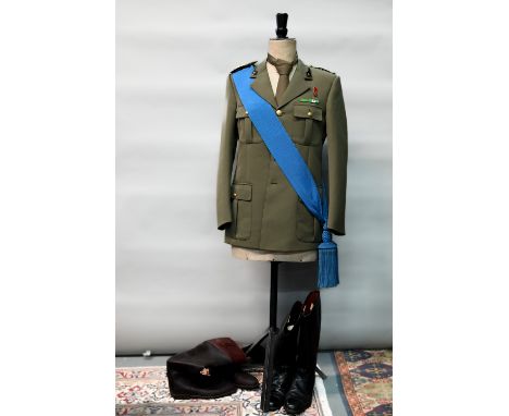 An Italian military uniform comprising dress tunic, trousers, tie and blue sash, to/w two pairs of riding boots (x2) 