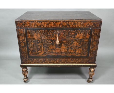 A late 18th/19th century Chinese export all-round black and gilt pictorial lacquered trunk, raised on gadrooned turned legs t
