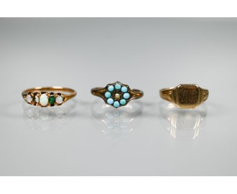 A 9ct yellow gold signet ring, size J, appox 1.9g; a turqouise set cluster ring and an opal ring (3) 