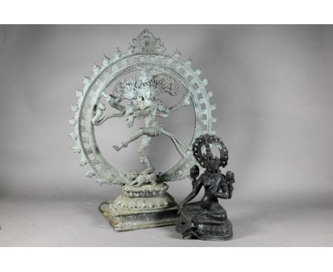 A 20th century Indian bronze figure of Shiva Nataraja dancing within a flaming halo with one foot on the demon Apasmara on a 