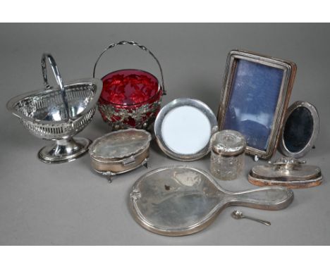 A silver ring-box, nail-buffer, hand-mirror, toilet jar and three small photograph frames, to/w a Victorian electroplated oak