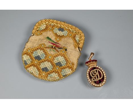 A dark red enamel locket with pearl set border and monogram below a pearl set and red enamel coronet, the verso with vacant l