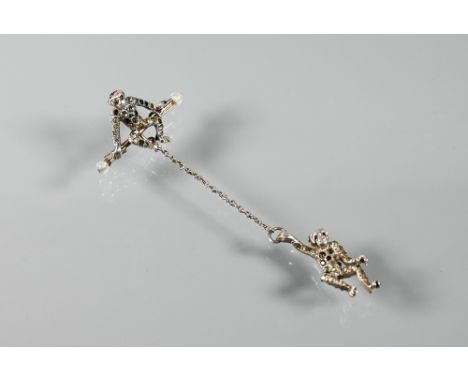 A gilt metal and green enamel bracelet in the form of conjoined frogs, three gilt metal and enamel brooches in the form of fr