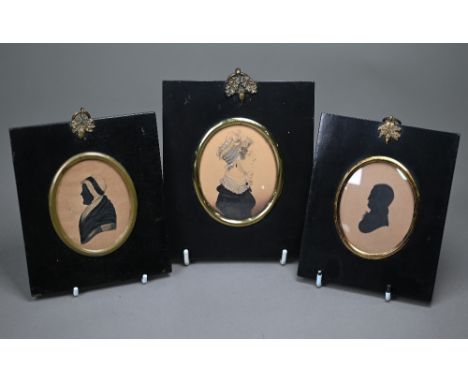 Two Georgian painted silhouette portraits of a lady and gentleman to/w a pencil, wash and bodycolour portrait of a young lady
